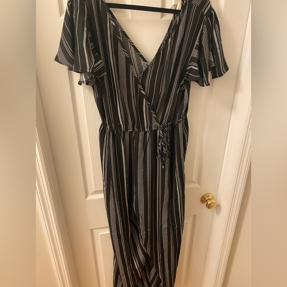 NWT pants romper. Black with white stripe and flutter sleeve